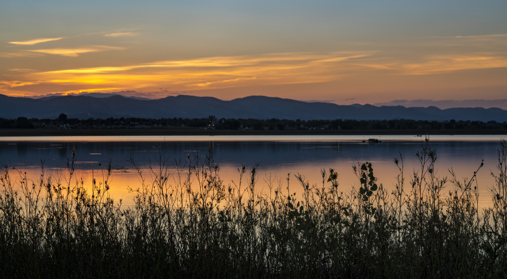 Berthoud Colorado, sunset over mountains near a lake, Longmont Braces