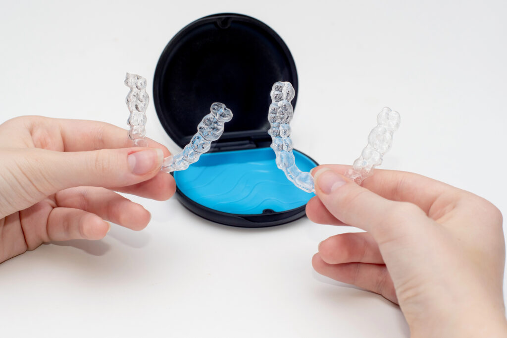 Invisalign Teen clear aligners in their case